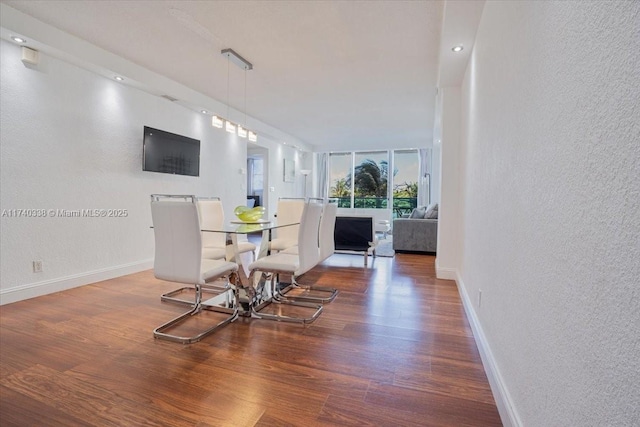 dining space with dark hardwood / wood-style flooring