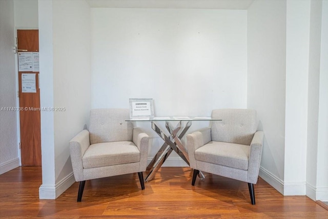 sitting room featuring hardwood / wood-style floors