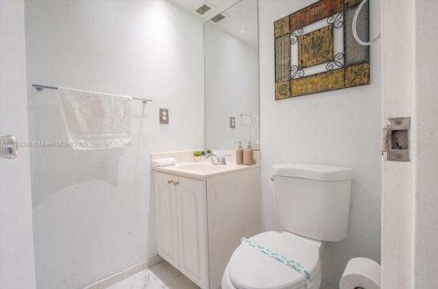 bathroom with toilet and vanity