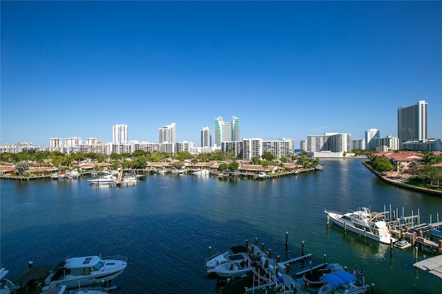 water view with a boat dock and a view of city