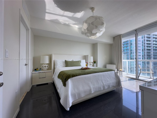 bedroom featuring expansive windows