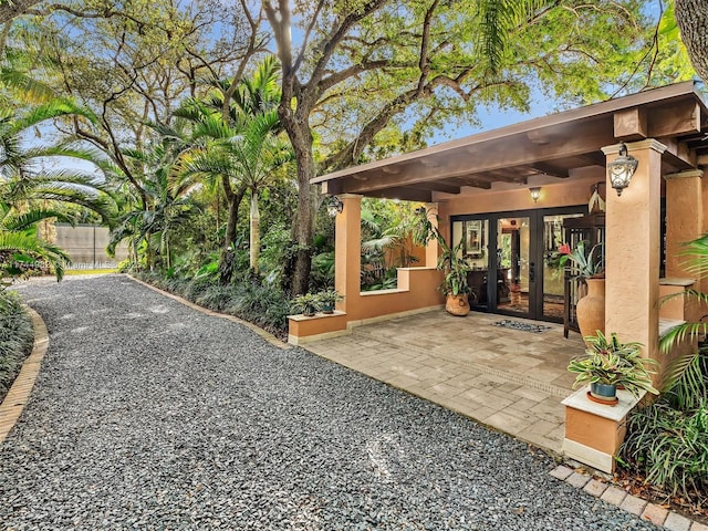 6200 SW 112th St, Pinecrest, FL 33156 - view of patio / terrace featuring french doors