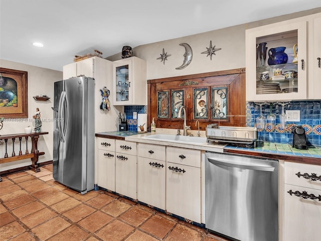6200 SW 112th St, Pinecrest, FL 33156 - kitchen featuring stainless steel appliances, a sink, tasteful backsplash, glass insert cabinets, and recessed lighting