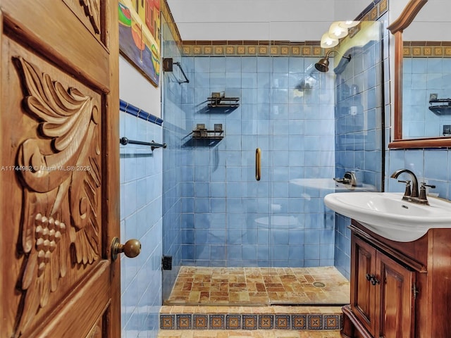 6200 SW 112th St, Pinecrest, FL 33156 - bathroom with tile walls, a stall shower, and vanity