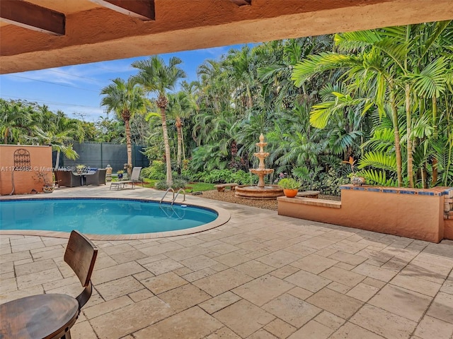 6200 SW 112th St, Pinecrest, FL 33156 - view of swimming pool featuring a patio area