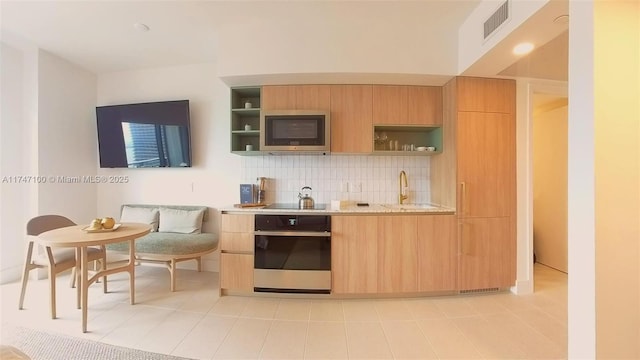 kitchen with wall oven, sink, backsplash, black electric cooktop, and stainless steel microwave