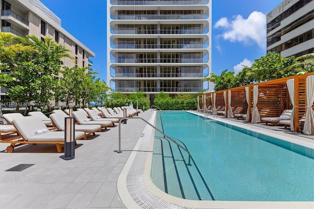 view of swimming pool featuring a patio