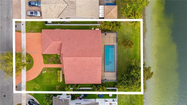 birds eye view of property with a water view