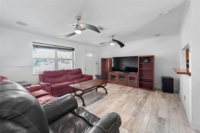 living room featuring ceiling fan and light wood-type flooring