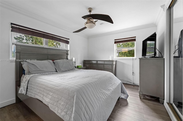 bedroom featuring crown molding, ceiling fan, and wood-type flooring