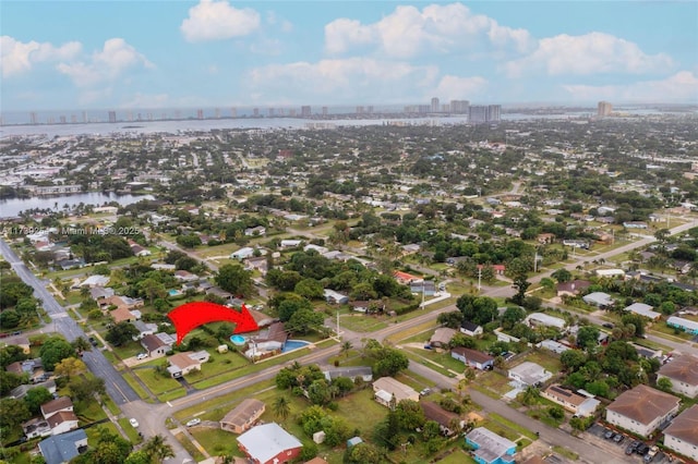drone / aerial view with a water view and a city view