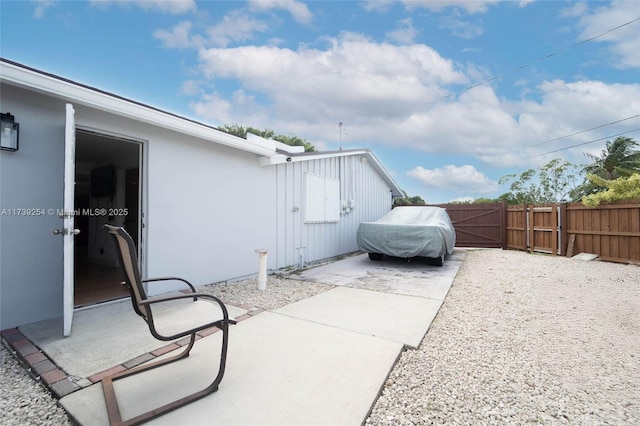 view of patio / terrace featuring fence
