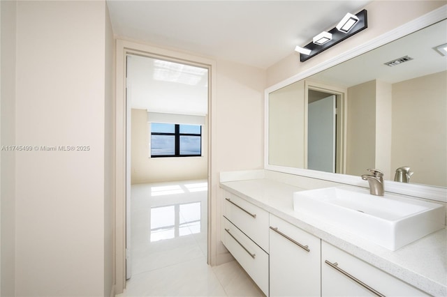 bathroom with vanity and tile patterned flooring