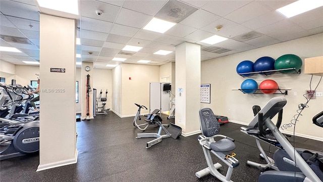 workout area featuring a drop ceiling