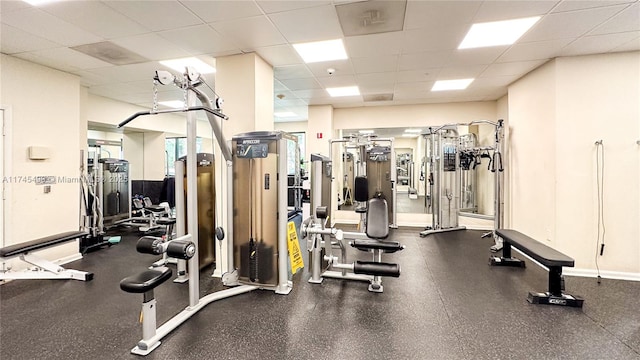 gym featuring a drop ceiling