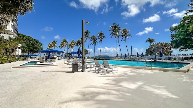 view of swimming pool featuring a patio area