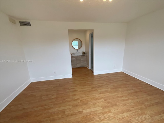 unfurnished room featuring light wood-type flooring