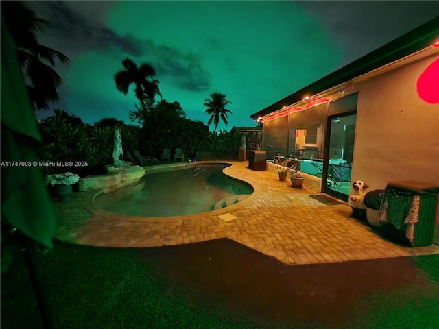 view of swimming pool with a patio