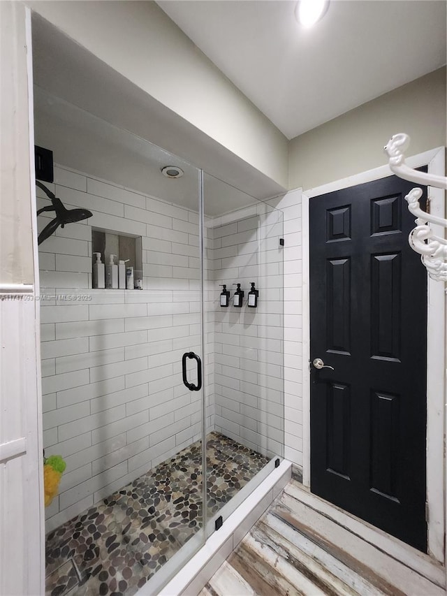 bathroom featuring an enclosed shower