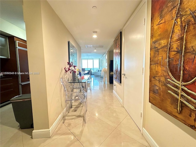 hallway with light tile patterned floors