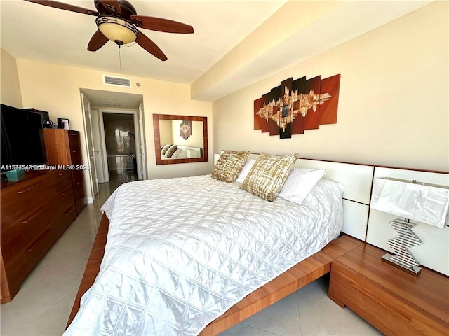 tiled bedroom with ceiling fan