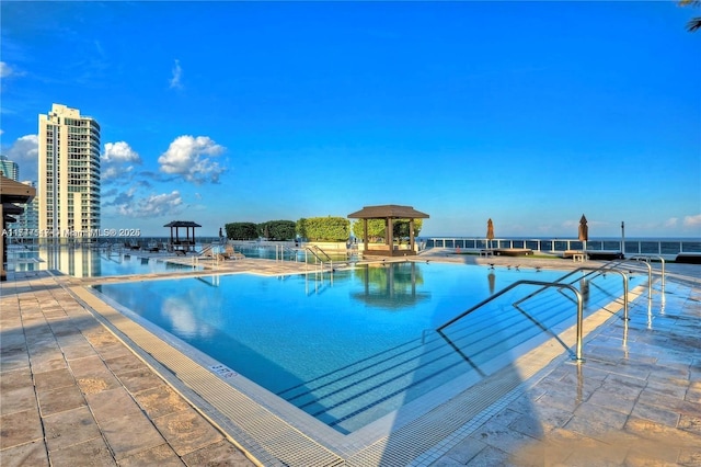 view of pool featuring a gazebo and a patio area