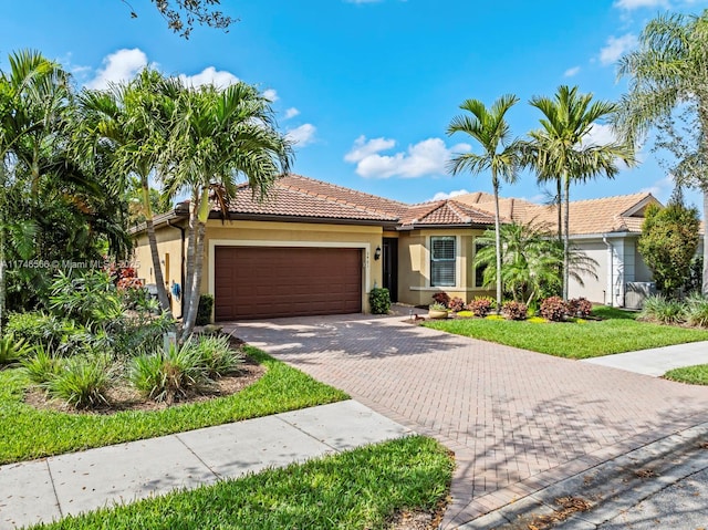 mediterranean / spanish-style house featuring a garage