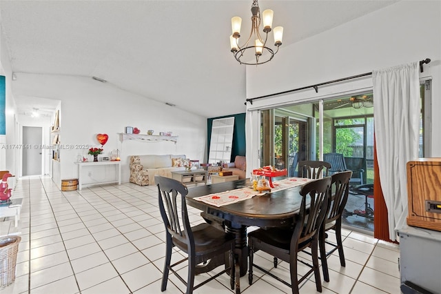 tiled dining room with vaulted ceiling and an inviting chandelier