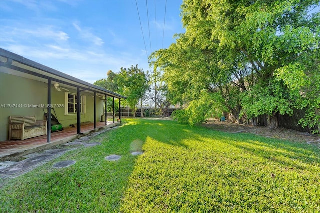 view of yard featuring ceiling fan