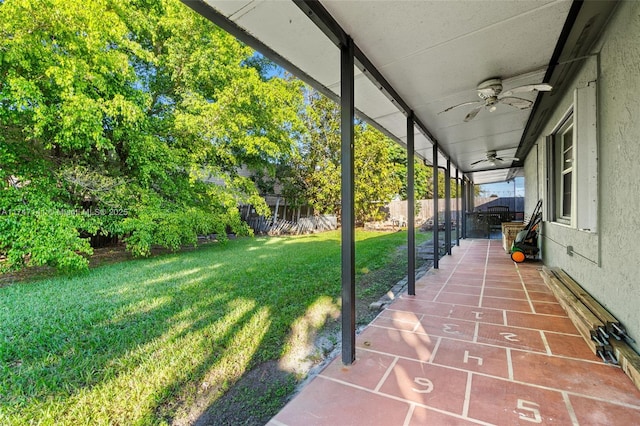 exterior space featuring ceiling fan