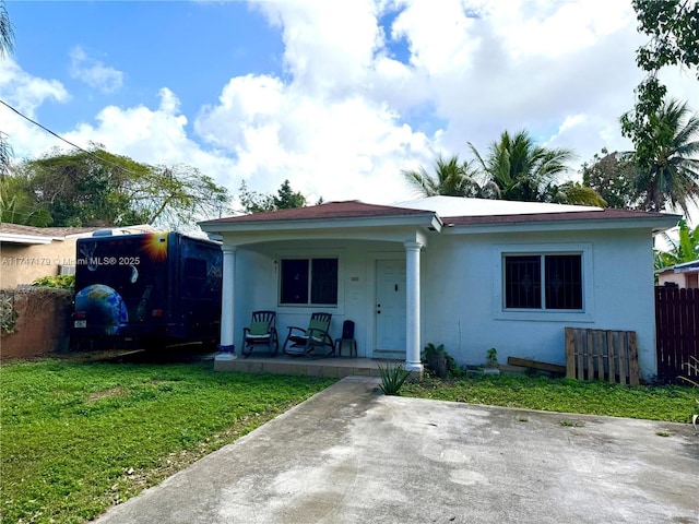 view of front of property with a front lawn and a porch