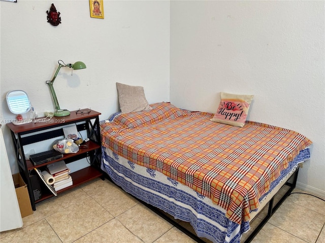 bedroom with light tile patterned floors