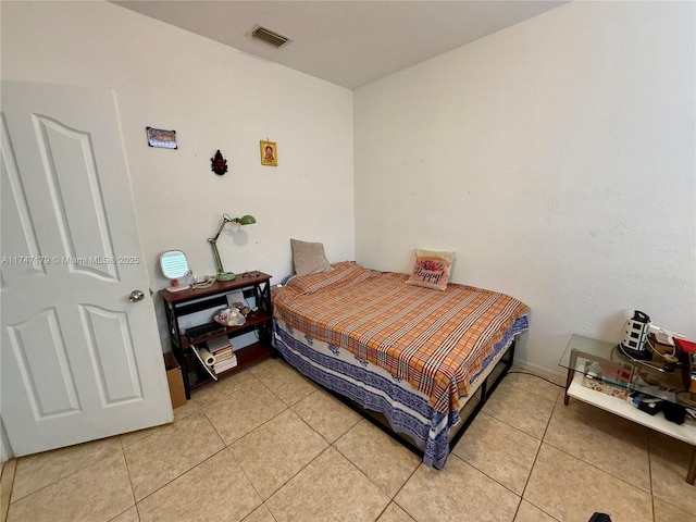 bedroom featuring tile patterned flooring