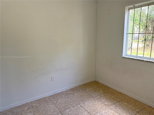 spare room with light tile patterned flooring