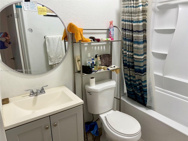 full bathroom with shower / tub combo, vanity, and toilet