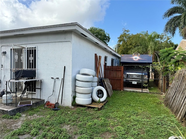 view of home's exterior with a lawn