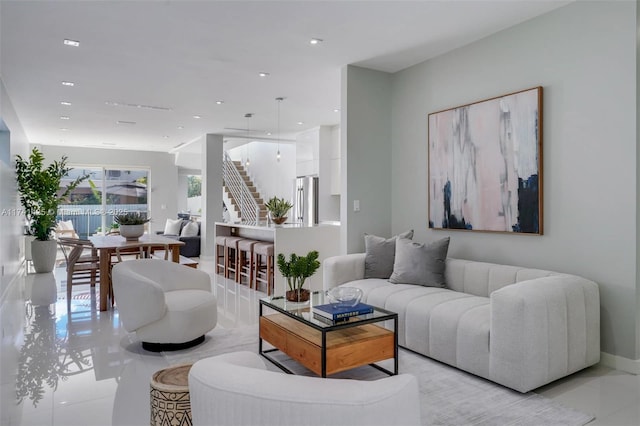 living area with stairway and recessed lighting