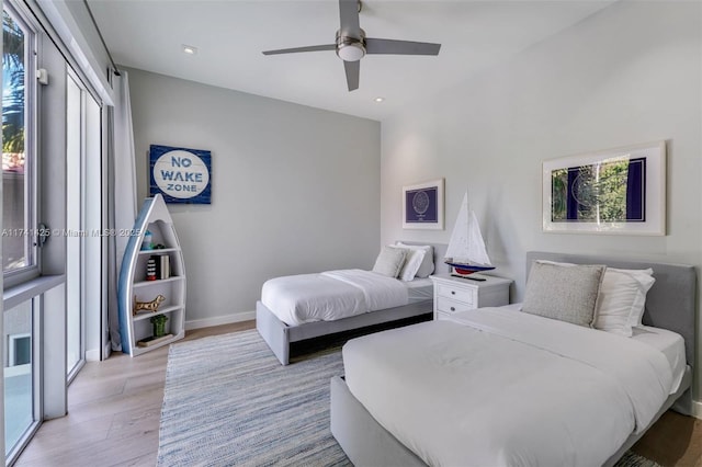 bedroom with recessed lighting, light wood-type flooring, a ceiling fan, and baseboards