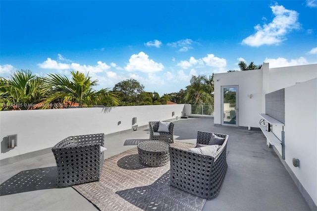 view of patio / terrace featuring outdoor lounge area and fence