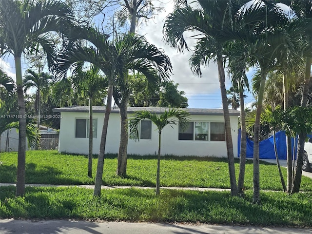 view of side of property featuring a lawn