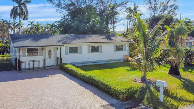 ranch-style house with a front yard