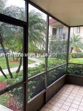 unfurnished sunroom featuring a healthy amount of sunlight