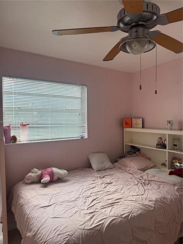 bedroom featuring ceiling fan