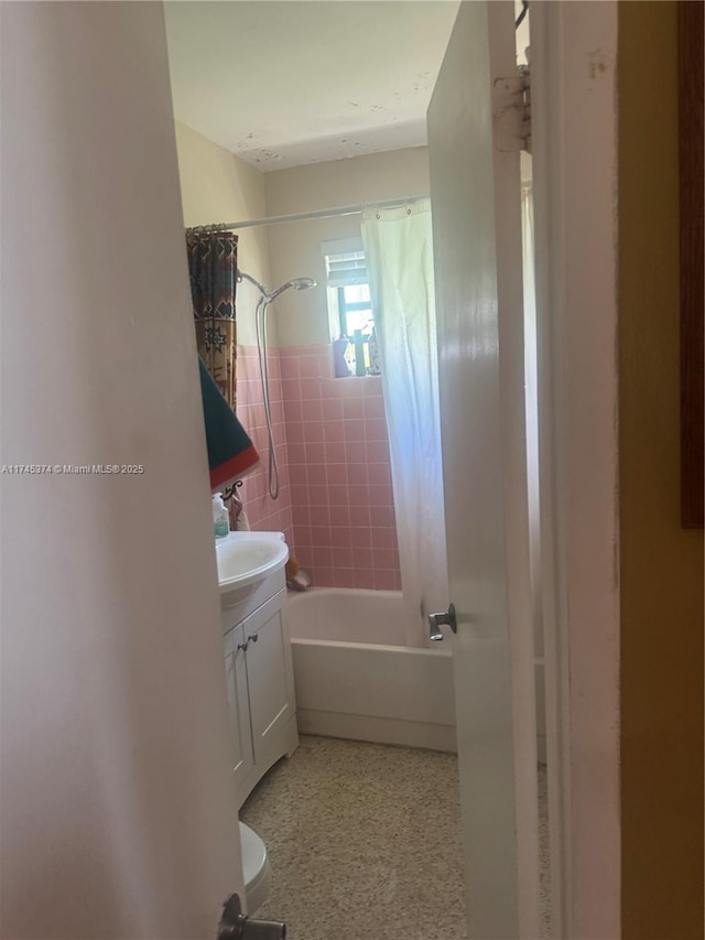 bathroom featuring shower / bath combination with curtain and vanity