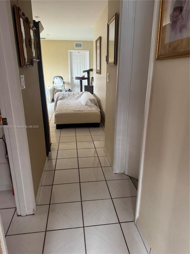 corridor with light tile patterned floors