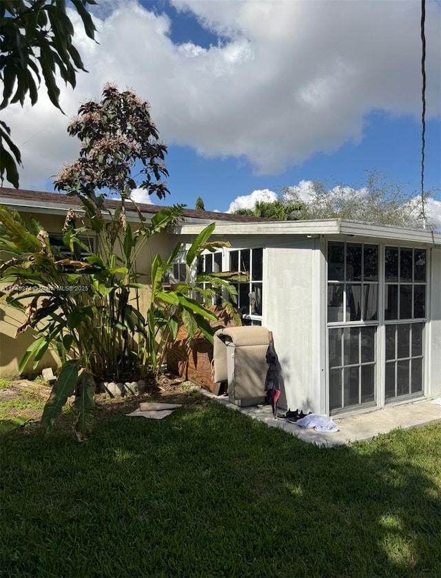 rear view of property with a yard