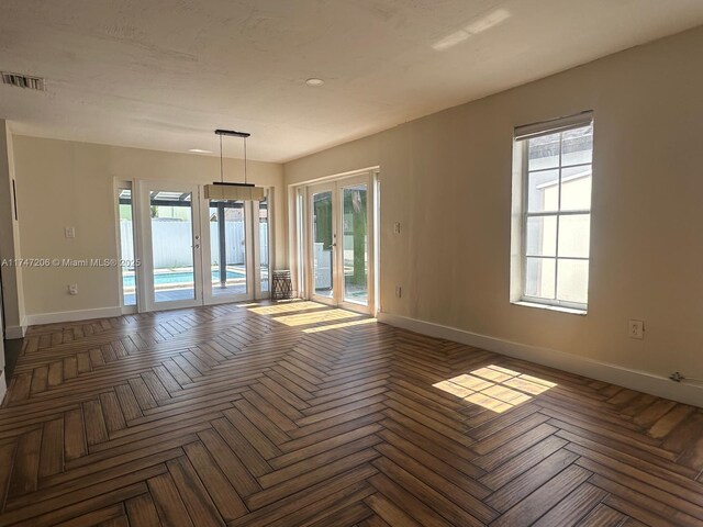 13926 SW 164th St, Miami, FL 33177 - spare room with french doors, baseboards, and plenty of natural light