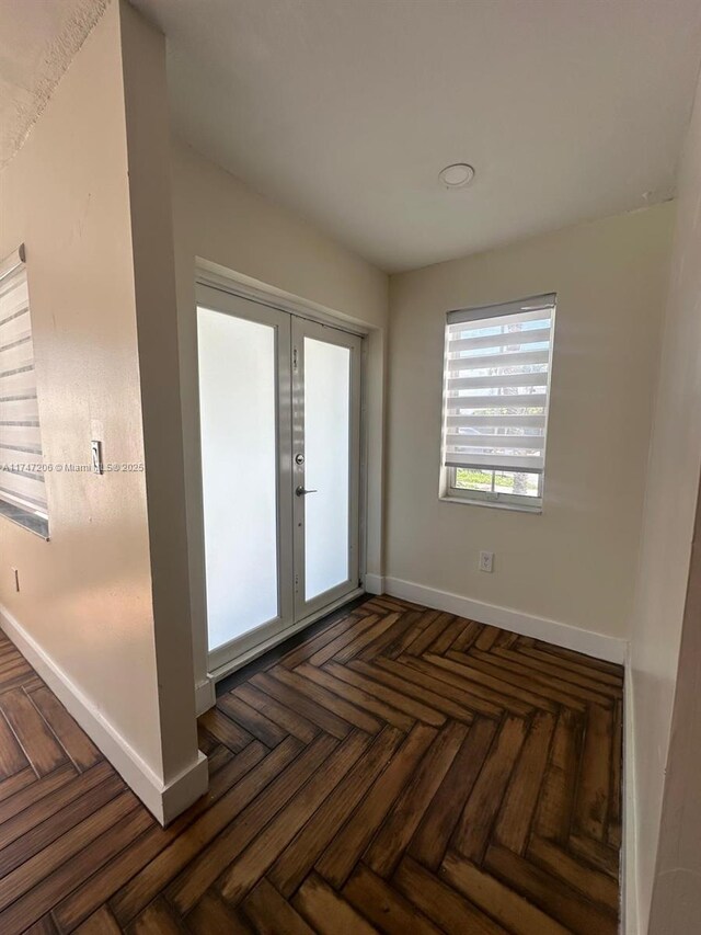 13926 SW 164th St, Miami, FL 33177 - empty room featuring baseboards and french doors