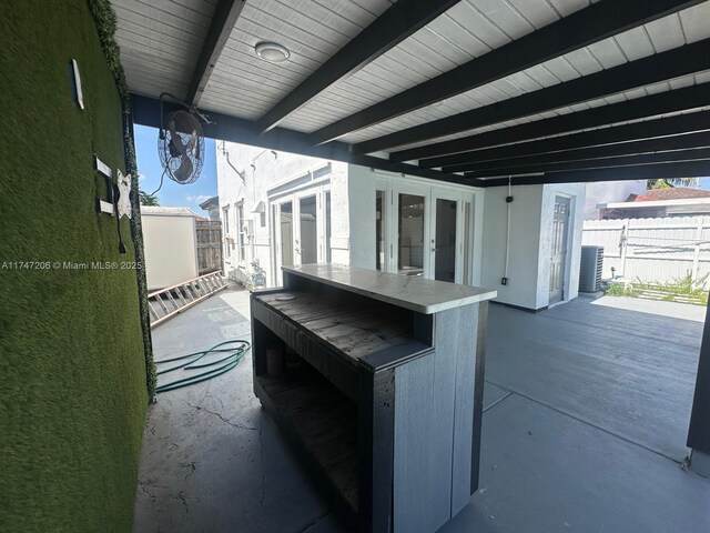 13926 SW 164th St, Miami, FL 33177 - view of patio / terrace featuring french doors and fence