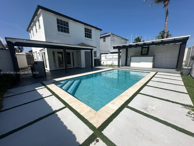 13926 SW 164th St, Miami, FL 33177 - view of swimming pool with a patio area, fence, and cooling unit
